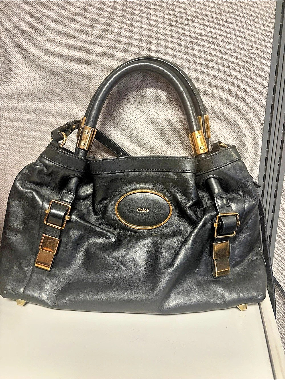 Chloé Victoria Tote distinguished by its signature gold-embossed oval logo plate